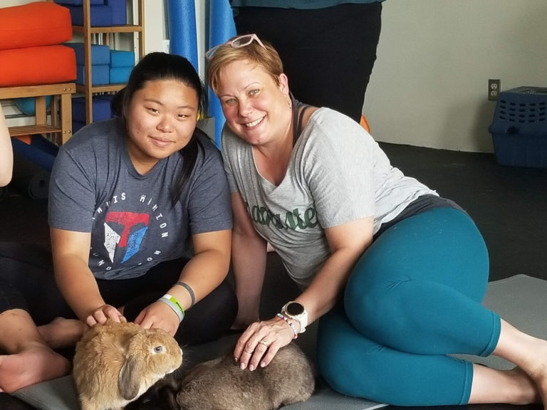 Mentoring extends to high school: Pairs connect through rabbit yoga and other shared interests