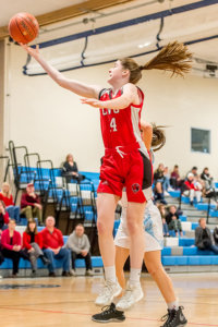 CVU Catherine Gilwee leaps to the basket. Photo by Al Frey