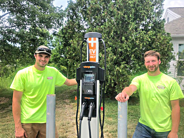 Cummings Electric built the base and installed the charger at Town Hall on July 10. Photos by Dean Bloch