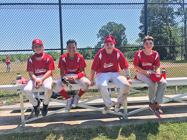The Suburbans Babe Ruth team is on a short but intense schedule this summer, playing three games a week over a five-week period. Missing is George Taylor; in the photo, left to right, is Ronan Evans, Daniel Tuiqere, Lander Magoon and Gabe Merrill. Photo by Chea Waters Evans