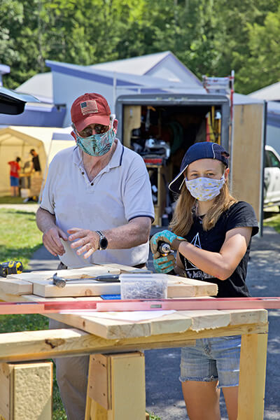 Walter Adams and Luna Van Deusen volunteered at the Lake Champlain Waldorf School, building outdoor classrooms so students can safely social distance while learning.Photo by Jen Zahorchak
