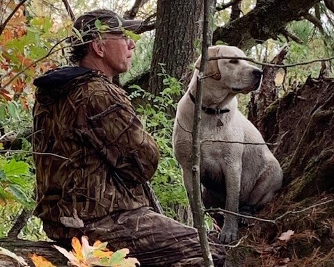 Right: John Lesher and his puppy, Finbar, made the trek to Wood Duck Heaven with Bradley Carleton.  Photo by Bradley Carleton