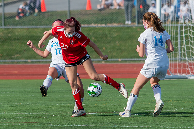 Josie Pecor splits the defense. Photo by Al Frey