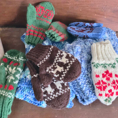 Caps and mittens knitted by Hilary Smith. Photo by Cindi Robinson