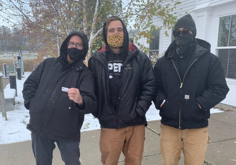 From left: co-workers Simon Burrows, Elliot Lacroix and Julian Lacroix. Photo by Shay Brunvand/Community News Service