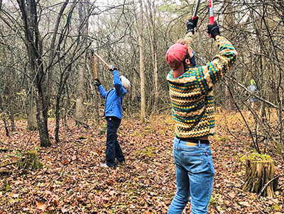 Judith Murphy and Colin Thoman pruned trees back to cross-country-ski height. Courtesy photo