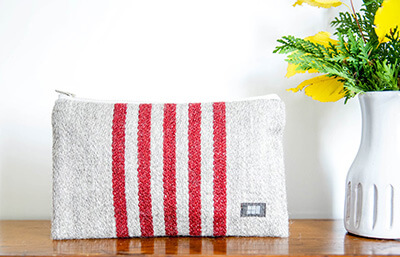 The striped café clutch at Philo Ridge Farm is a purse for a normal person or a lip balm holder for a hoarder.