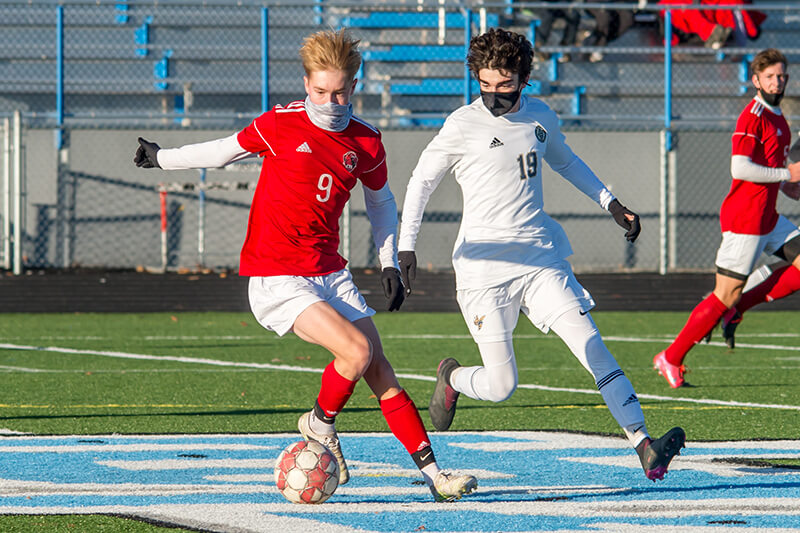 Charlotte All-Stater Ben Sampson dribbles past a Hornet. Photo by Al Frey