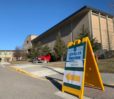 The sun was shining in Hinesburg on Wednesday morning as educators and staff lined up to get their COVID-19 vaccines at Champlain Valley Union High School. Photo by Maddy Holden.