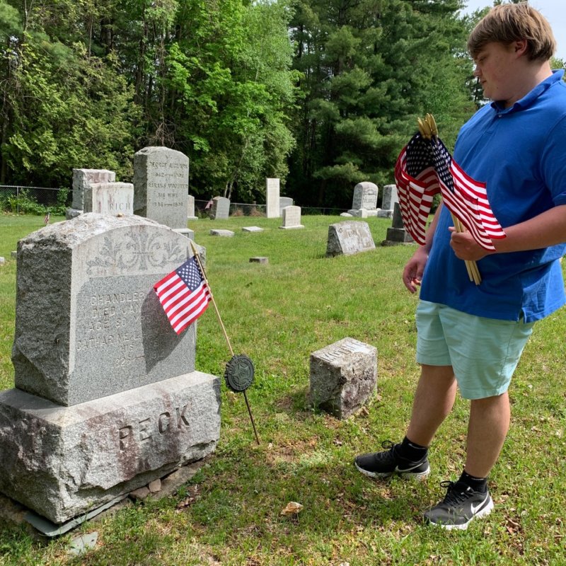 Stuart Robinson placing Memorial Day Flags in 2020. Photo contributed