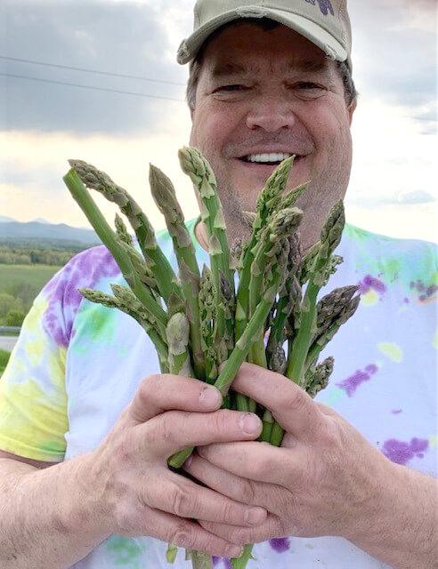 Bradley is excited about his wild asparagus treasure. Photo contributed