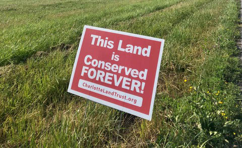 What are those red conserved land signs?