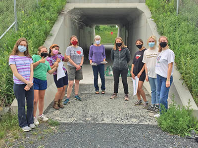 Charlotte Trails Committee and CVU art and design students pair up to paint the underpass