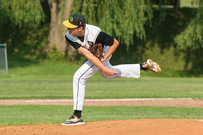 Jonas Keim follows through for the Shamrocks.Photo by Al Frey