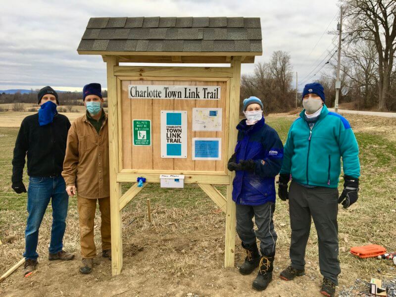 The kiosk stolen is pictured here with Trails Committee members who helped install it on January 1, 2021. The Charlotte News file photo