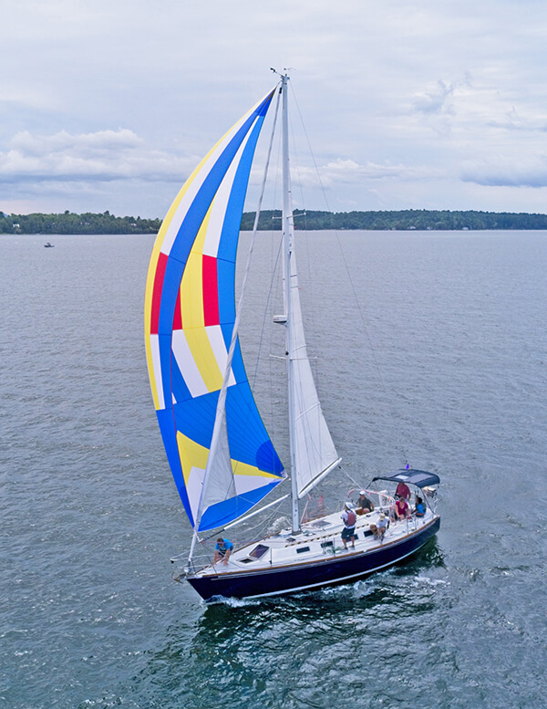 Muse, representing both Diamond Island Yacht Club and Lake Champlain Yacht Club, flies its spinnaker during the Diamond Island Regatta on Aug. 14. — Photo by Ramsey Hazbun