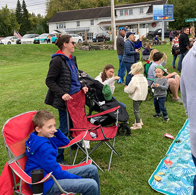 Parade attendees wait for tractors to come.