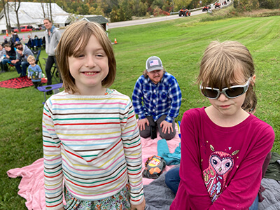 Twins left to right: Delilah and Lillian Brown,7, and wait for the Parade.