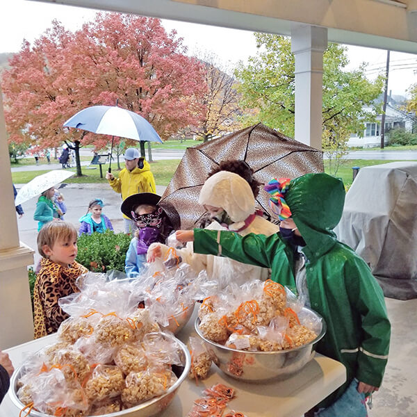 Trick-or-Treaters grab for goodies on Halloween at the Senior Center. Photo by Jim Hyde
