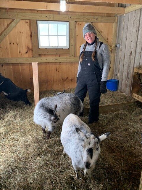 Margaret Aiken with her goats at Flower Gap Farm. Photo by Lucie Lehmann