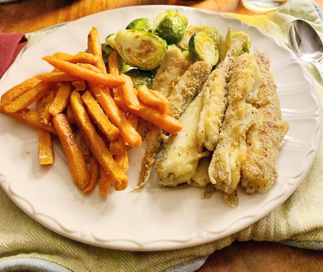 Crispy tails with brussel sprouts and fries. Photo by Bradley Carleton