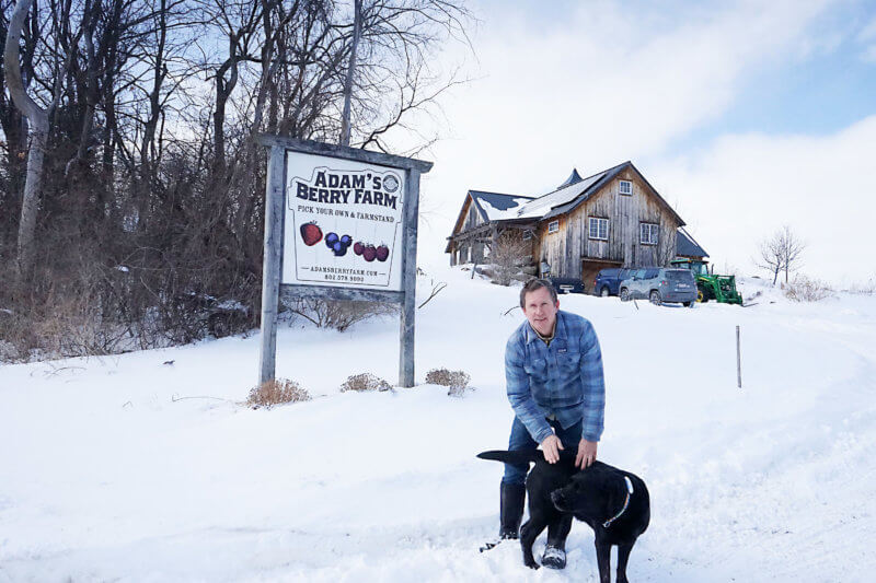 Photo by Halle T. Segal Adam Husmann outside his Adam’s Berry Farm, one of the largest wholesale suppliers of organic produce to restaurants and markets in the Charlotte area.