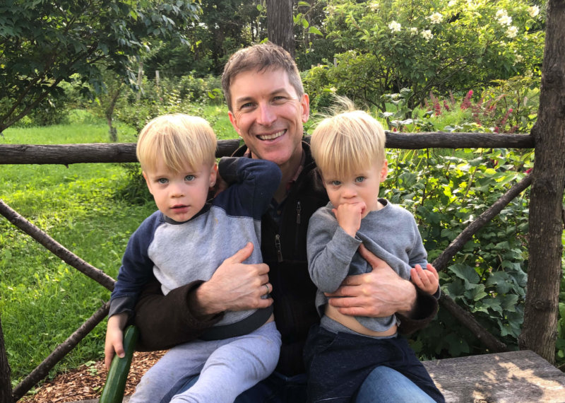 Brian in the garden with his children, Kit (left) and Tate. Photo contributed