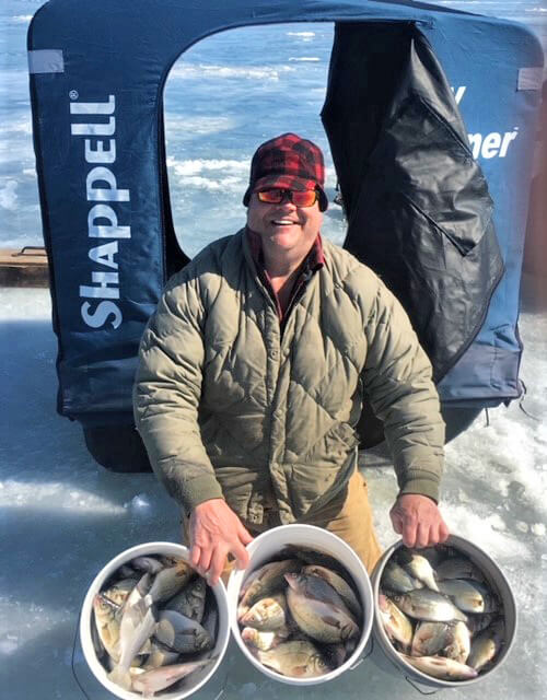 Photo contributed Bradley Carleton shows off the buckets of whiteys he and others caught while ice fishing.