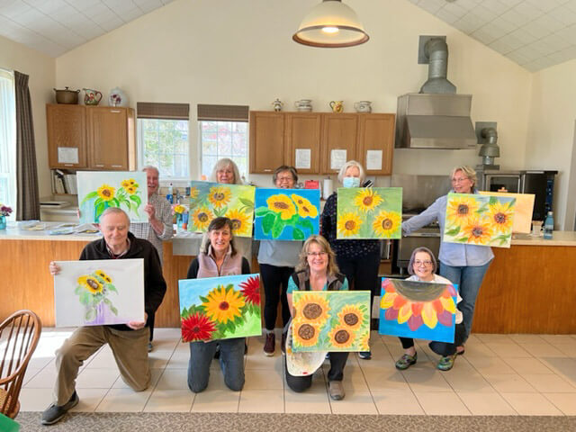 Photo by Sherry Senior Locals participated at Coffee and Canvas at the Charlotte Senior Center. Each painted their own unique Sunflowers with the direction of Sherry Senior.