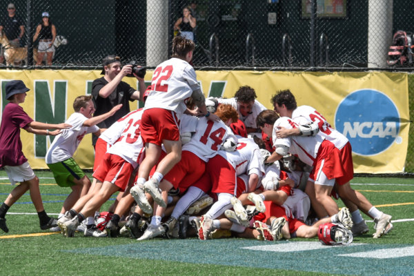 Photo by Al Frey The Champlain Valley Redhawks celebrate a hard fought 13-11 Division 1 boys lacrosse state championship win over the Burr and Burton Bulldogs on Saturday afternoon at the University of Vermont’s Virtue Field.