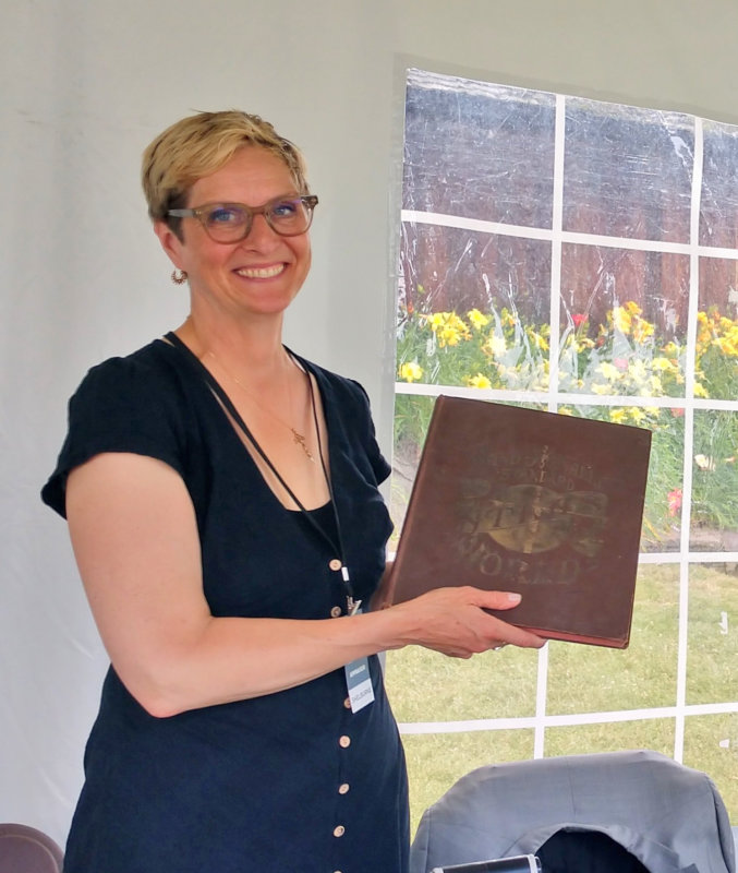 Photos by Juliann Phelps Appraiser Devon Eastland of Swann Auction Galleries evaluates an atlas.