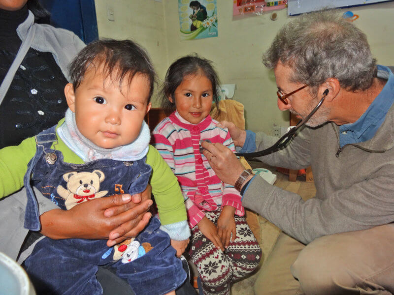 Courtesy photo Barry Finette bringing medical care to children in the central highland region of Peru.