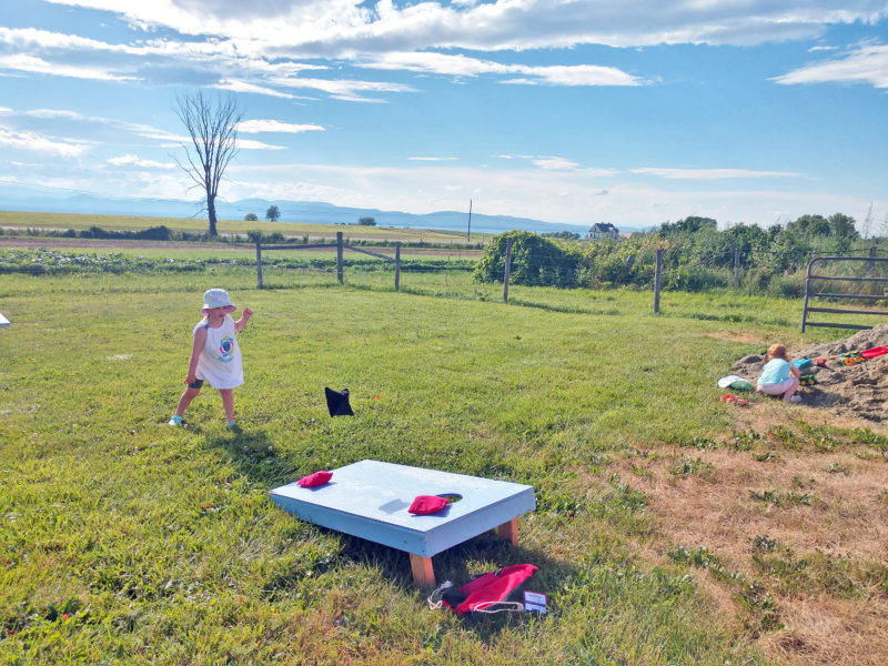 Photo by Juliann Phelps. Alexandra and Vivian Phelps enjoyed playing at Earthkeep’s Farm Night.