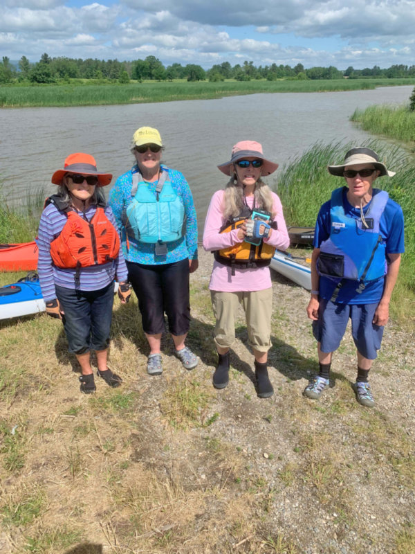 Photo by Lori York. From left, Raymonde Mayhew, Sue Mills, Laura Cahners-Ford and Diane Leary resting during a Charlotte Senior Center kayaking trip on Dead Creek.