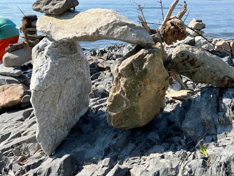 Photo by Evan Webster Screen printer and artist Evan Webster built this rock arch, but doesn’t know who the other rock artists at the Charlotte Town Beach are.