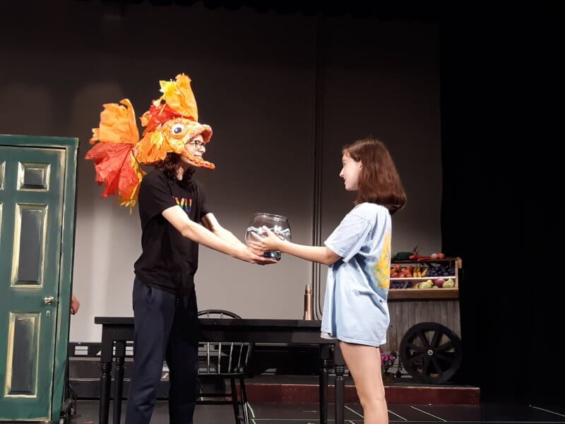 Vivian Volzer (young Amélie) and Addison Hoopes (Fluffy, her pet fish) rehearse a scene in CVU’s production of Amélie.