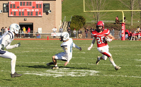Photo by Scooter MacMillan Redhawk junior Calvin Steele makes one would-be tackler fall down as he runs with the ball.