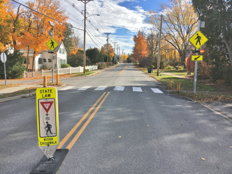 Photo by Brett Yates. Signs, including in the median, and painted crosswalks are strategies Shelburne has used to try to reduce speeding.