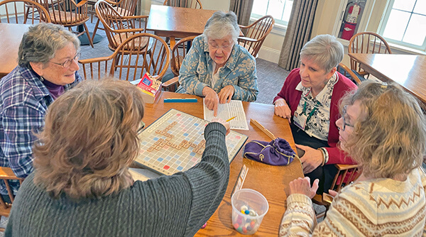 Photo by Lori York From left, Cyndie White, Kathy Ayers, Lin Kalson, Penny Burman and Diane Boucher play word games at the senior center. These Wednesday sessions feature a variety of games including Scrabble, Boggle and Bananagrams.