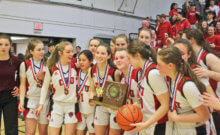Photo by Scooter MacMillan Winning the state title was a new experience for this team. The last Redhawk’s girls basketball championship came before they entered high school.