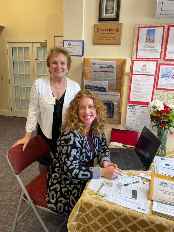 Photo by Lori York Carol Pepin, senior center Age Well volunteer, left, and Kerry Batres from Age Well at a recent Monday Munch promoting the Age Well restaurant ticket.