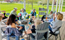 Courtesy photo The weather has been wonderful for book chats on the library porch on Wednesday afternoons.