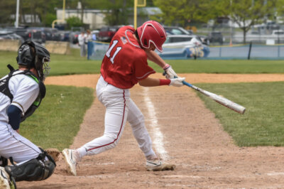 Photo by Al FreyCalvin Steele knocked in a go-ahead single in the sixth inning, setting up an 8-5 win over Essex High on May 20.