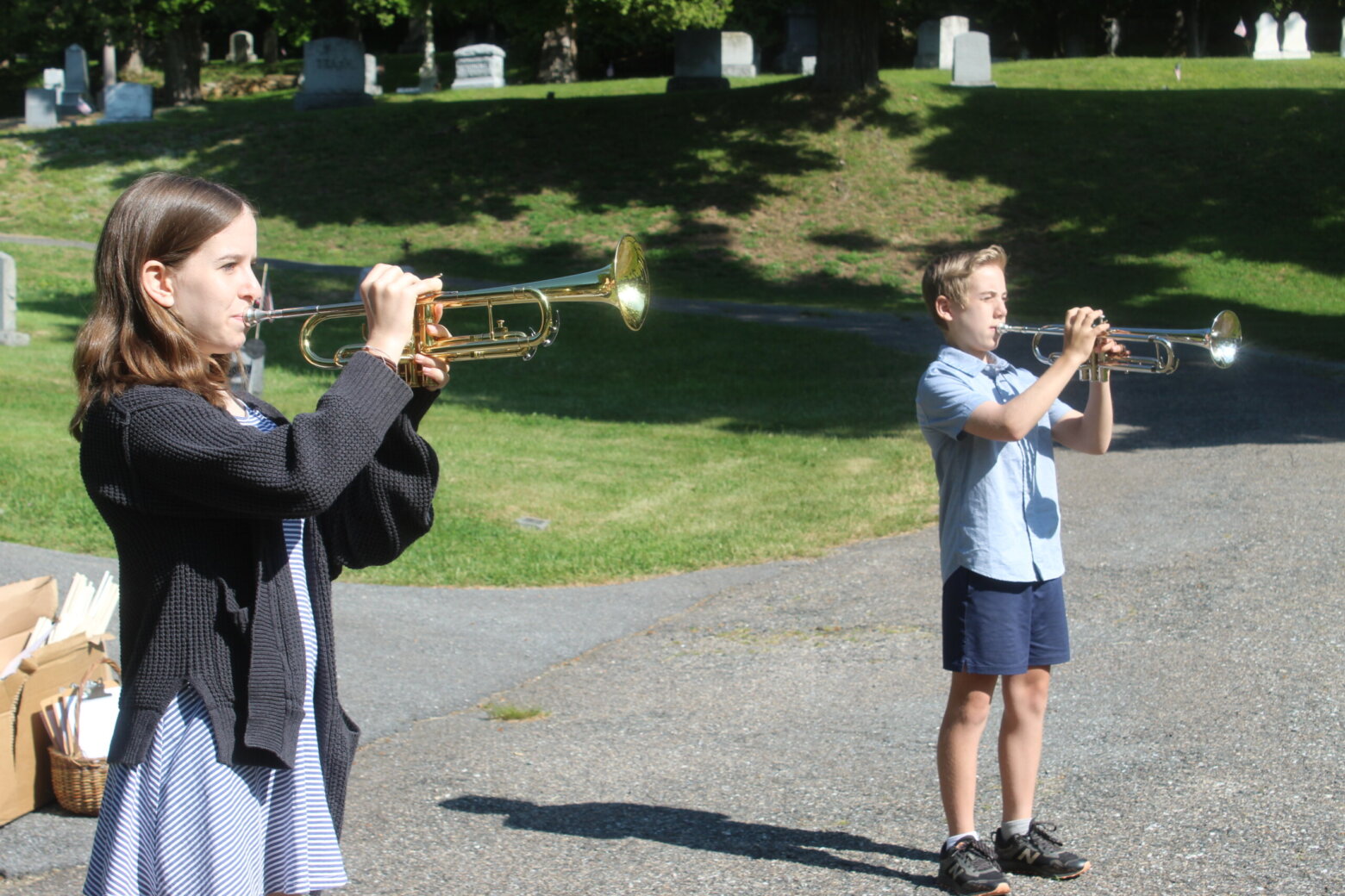 Sarah Stein and Oliver Smith leant a solemn mood to the ceremony by playing “Taps.”