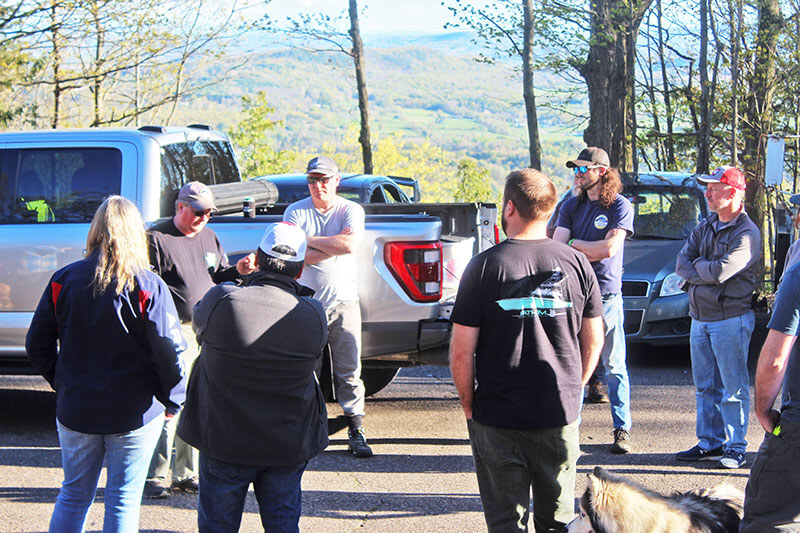 Photo by Scooter MacMillan.Seth Achilles and Eric Reisner give an orientation talk to competitors at the top of Mount Philo.