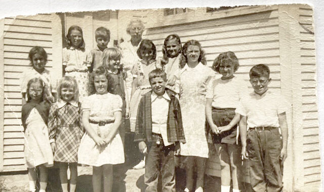 Courtesy photoSuzanne Foss shared this photo of Charlotte School No. 2. Known as the Spear School, this school was on the north side of Ferry Road, just west of Lake Road. This photo was taken in 1949, Foss’ first-grade year. The next year she was in the new consolidated school at Charlotte Central School, along with all the other Charlotte students from the 14 one-room schoolhouses. Foss (née De Wispelare) is the second girl from the left in the plaid dress. After closing this school building was moved to a nearby residence to use as a garage. If you know who the others in this photo are or have any other information, we would love to hear it at scooter@thecharlottenews.org.