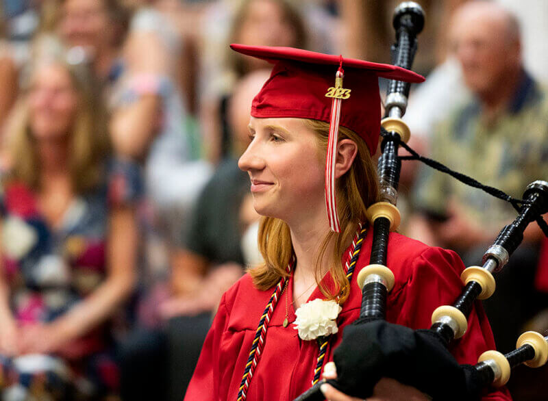 Photo by Alison Redlich BullisAva Rohrbaugh of Charlotte pauses before playing the bagpipes with the Saint Andrews Pipeband of Vermont as they lead her class' recessional at Champlain Valley Union High School's graduation ceremony at the University of Vermont’s Patrick Gymnasium on Friday, June 16.