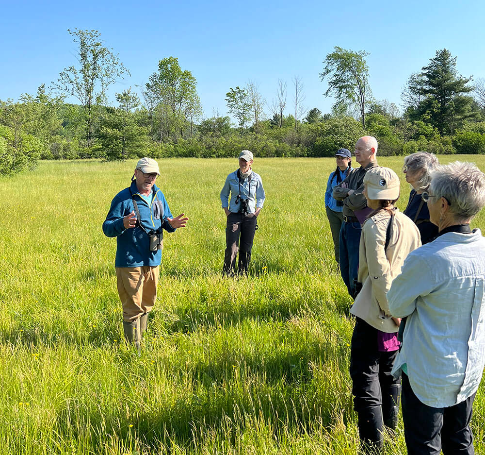 Courtesy photo Mark Labarr, a conservation biologist with the Audubon Society of Vermont, speaks to a group of neighbors on Lewis Creek Road about dealing with plant invasives and making their land more wildlife friendly.