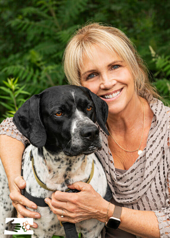 Photo by Kelly Schultz.
Joyce Cameron enjoys the company of Humane Society residents including Barrett.