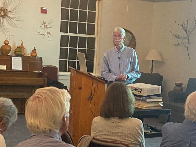 Geophysicist Paul Wagenhofer speaks to a gathering at the Charlotte Senior Center about the energy crisis.